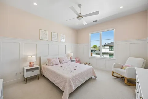 a bedroom with a bed and couch