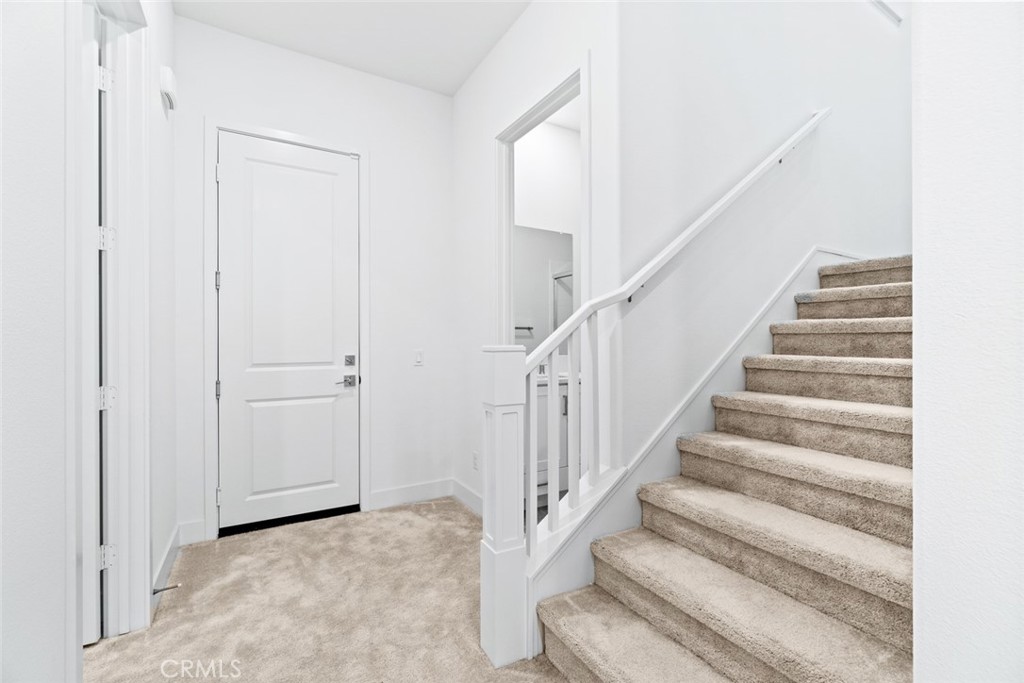 374 Baluster Irvine, CA 92618 - Photo 17 of 64 a view of staircase with white walls and white walls