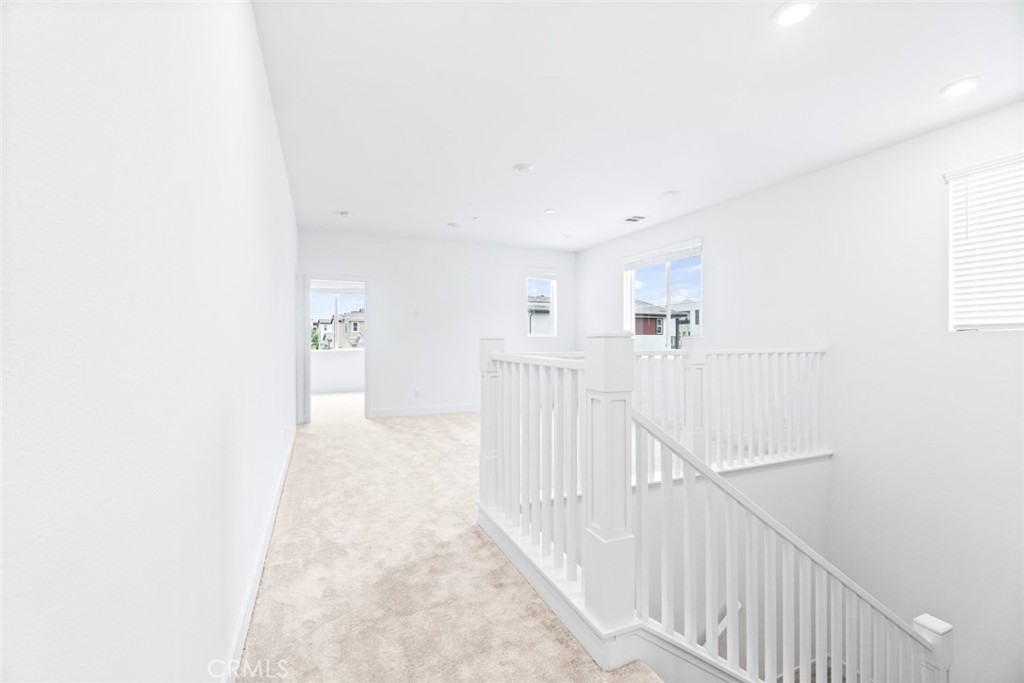 374 Baluster Irvine, CA 92618 - Photo 24 of 64 a view of a hallway with white walls
