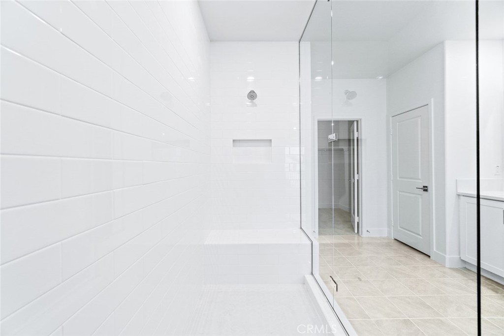 374 Baluster Irvine, CA 92618 - Photo 29 of 64 a bathroom with a shower and a glass door