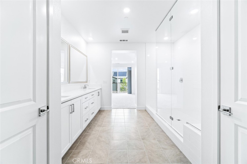 374 Baluster Irvine, CA 92618 - Photo 30 of 64 a large white bathroom with shower