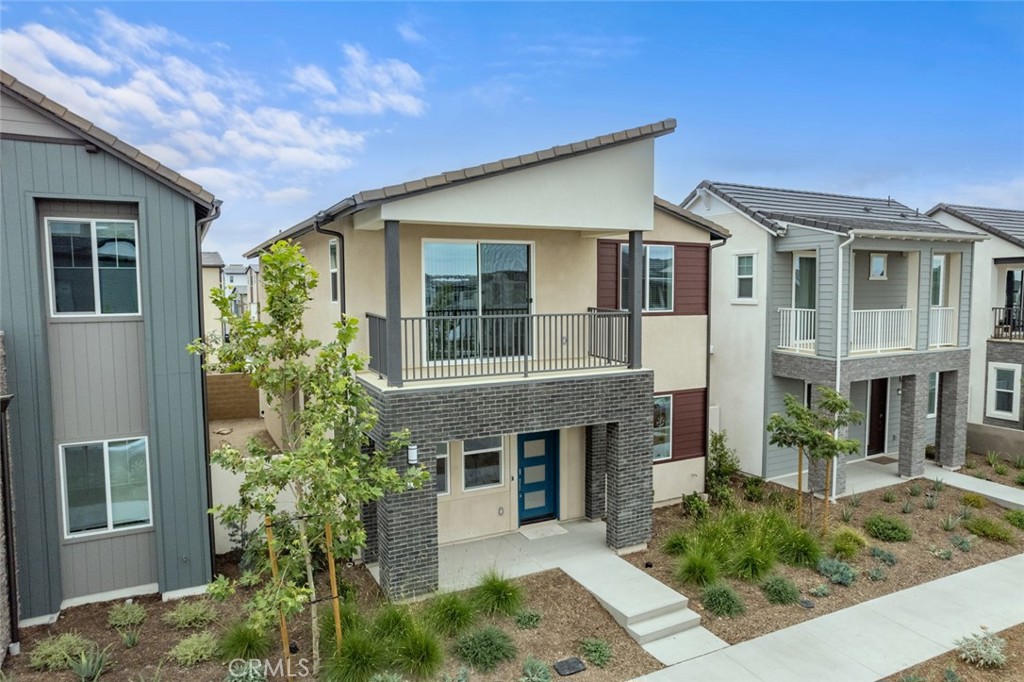 374 Baluster Irvine, CA 92618 - Photo 45 of 64 a front view of a house with garden