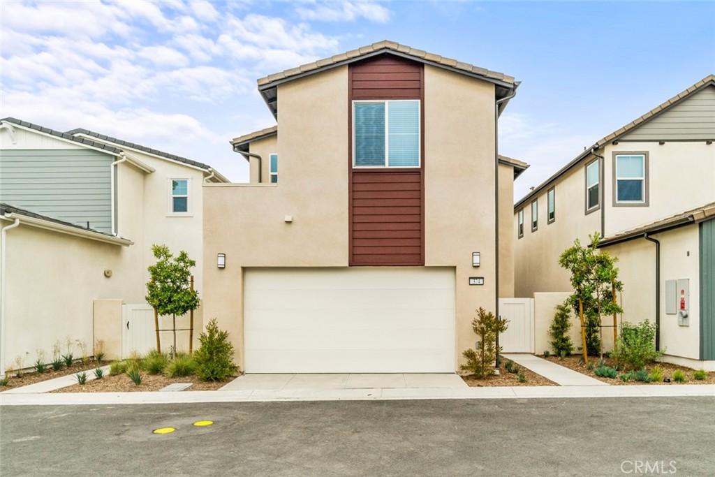 374 Baluster Irvine, CA 92618 - Photo 50 of 64 a front view of a house with a yard
