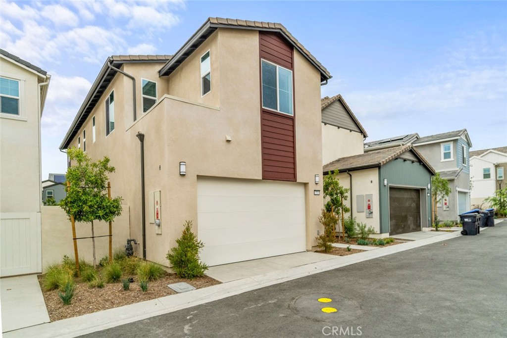 374 Baluster Irvine, CA 92618 - Photo 51 of 64 a front view of a house with a yard