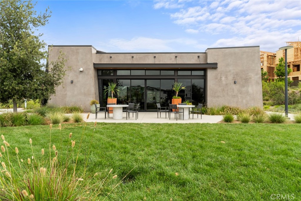 374 Baluster Irvine, CA 92618 - Photo 55 of 64 a view of a building with a yard