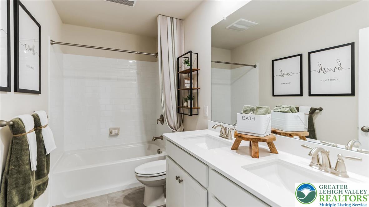109 Winding Road Easton, PA 18040 - Photo 14 of 29 a bathroom with a sink a toilet and shower