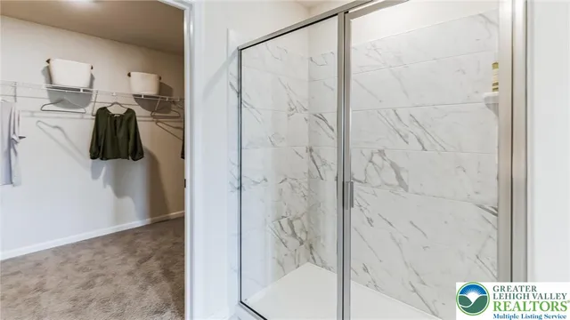 a spacious bedroom with a bed and a painting on the wall