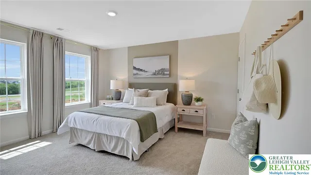 a bed room with a bed and a lamp