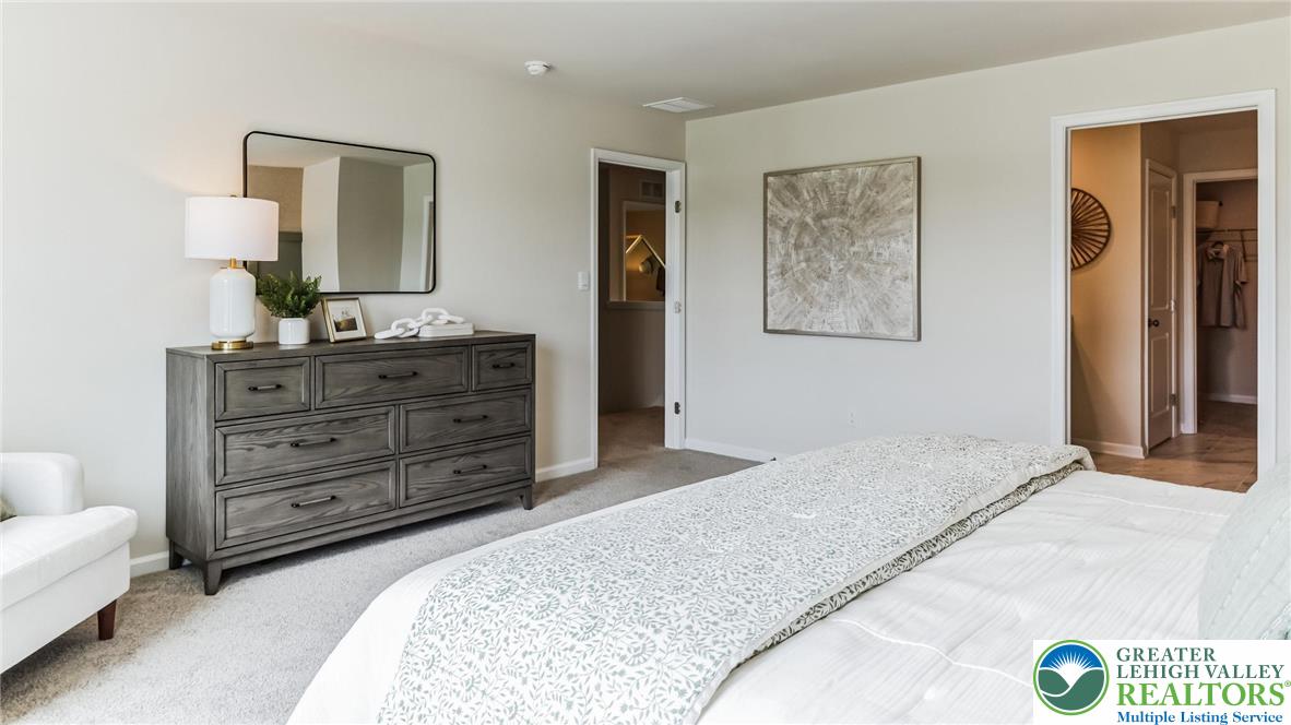 109 Winding Road Easton, PA 18040 - Photo 19 of 29 a bedroom with a bed and a dresser