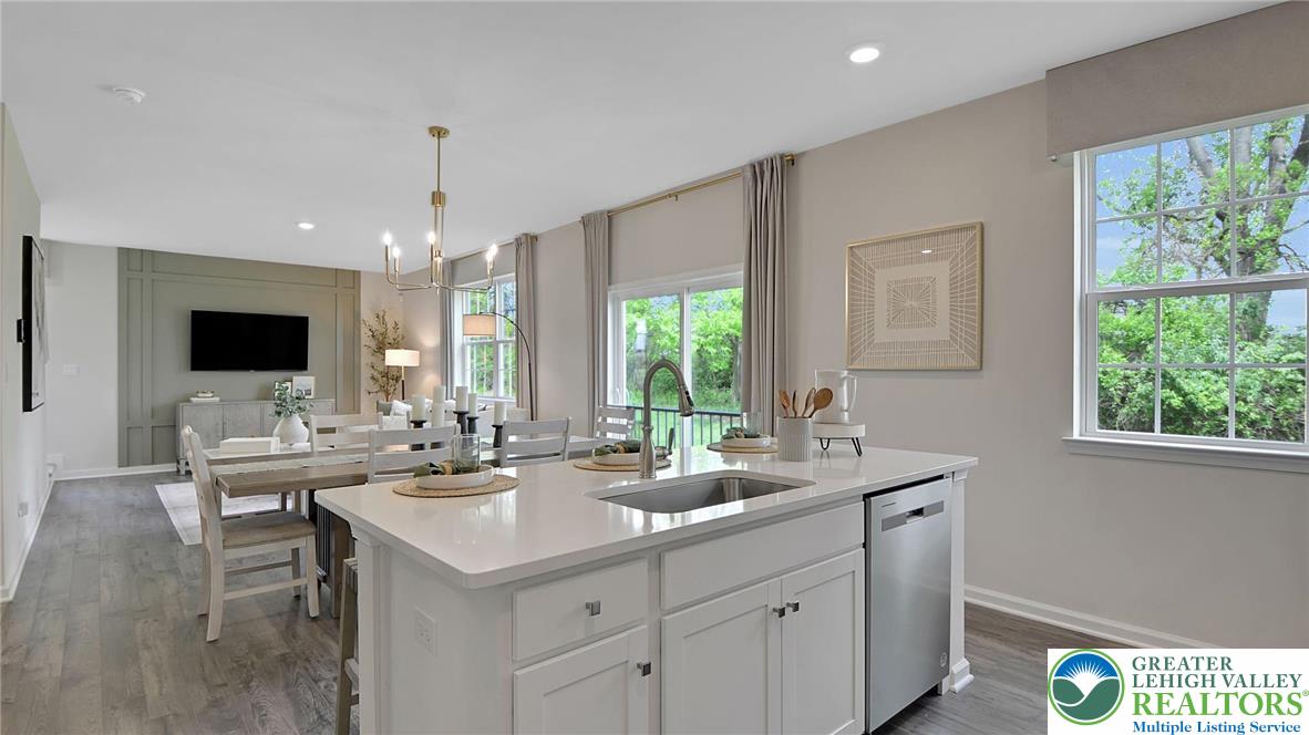 109 Winding Road Easton, PA 18040 - Photo 8 of 29 a view of a kitchen with kitchen island a sink stainless steel appliances and living room view