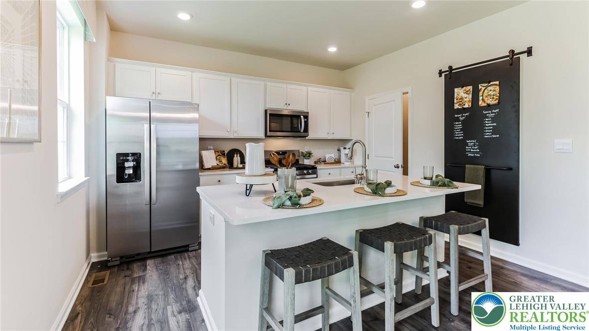 109 Winding Road Easton, PA 18040 - Photo 9 of 29 a kitchen with stainless steel appliances a refrigerator and a stove