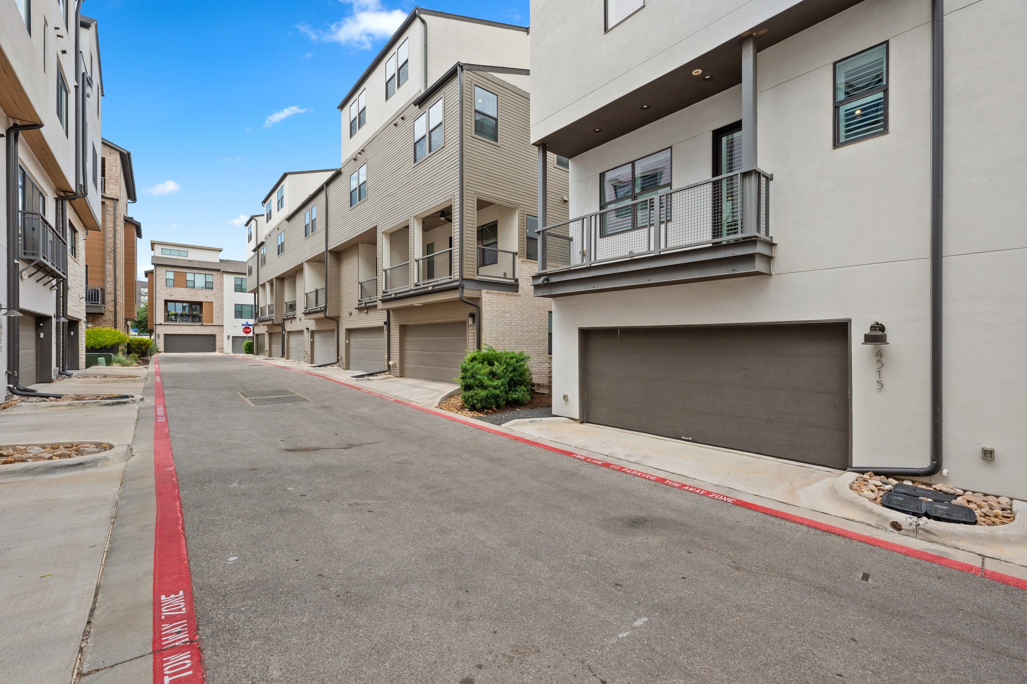 4515 Unity Circle Austin, TX 78731 - Photo 22 of 37 Modern multi-level architecture highlights this contemporary exterior featuring private garages and upper-level balconies.