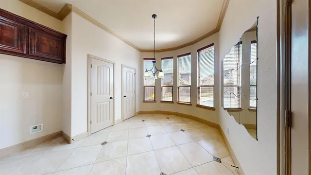 a view of a livingroom with wooden floor and a ceiling fan