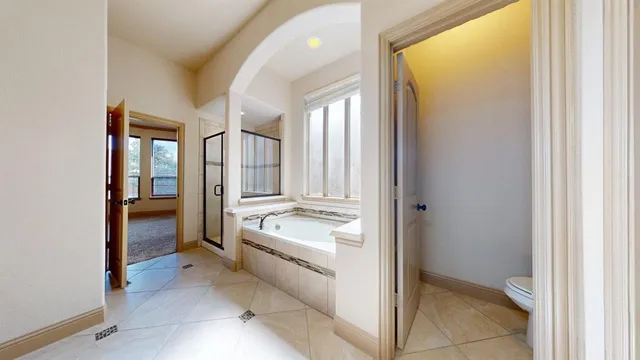 a view of a bathroom with tub