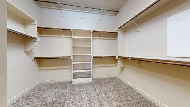 a view of a room with window and cabinet