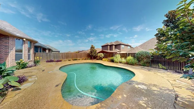 a view of a house with swimming pool