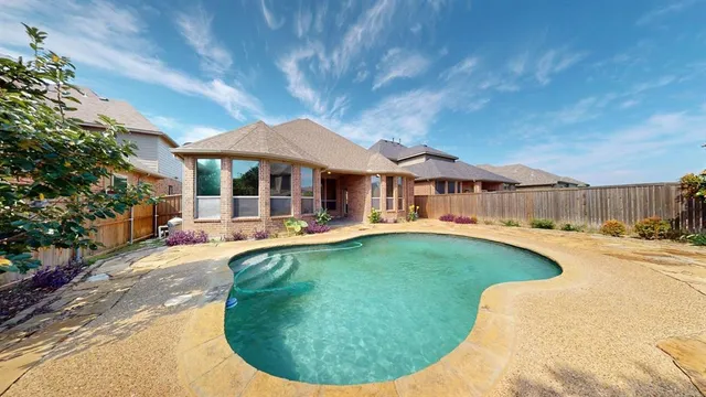 a view of a swimming pool with a patio