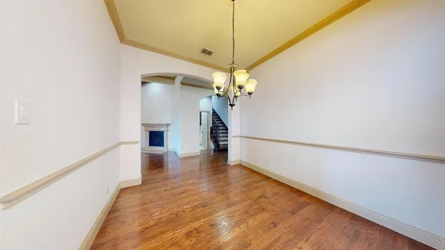 a view of a door and wooden floor