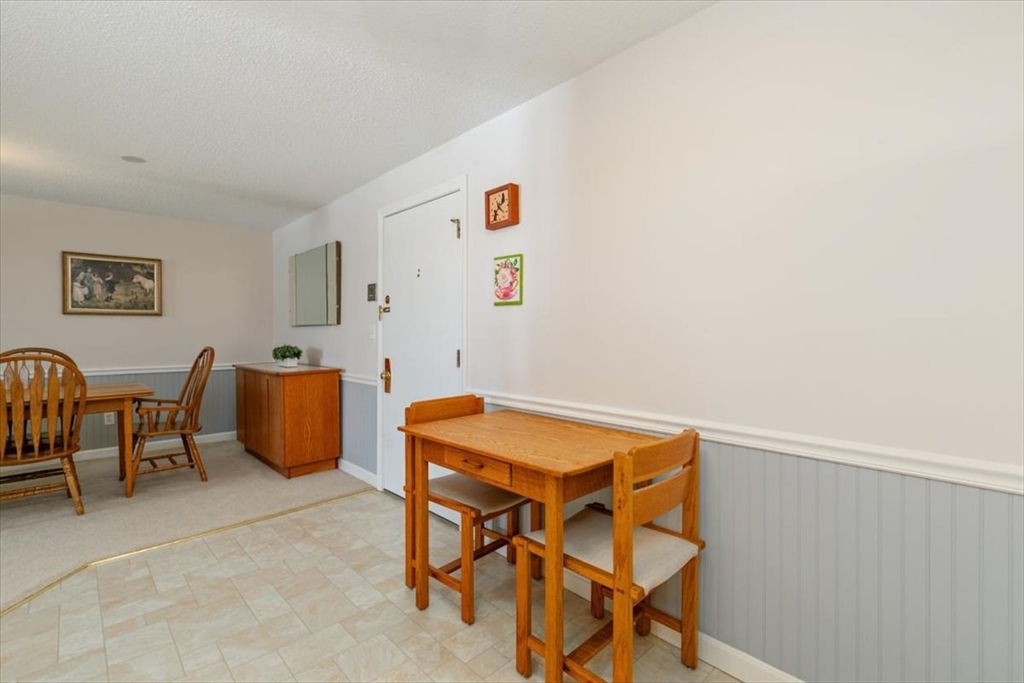 42 Main Street, Unit 22 North Reading, MA 01864 - Photo 12 of 37 a view of a room with chairs and a table