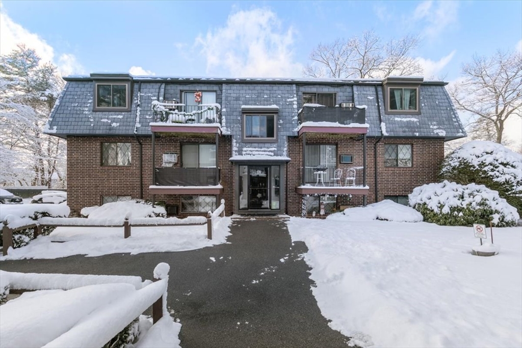42 Main Street, Unit 22 North Reading, MA 01864 - Photo 2 of 37 a view of a house with yard and sitting area