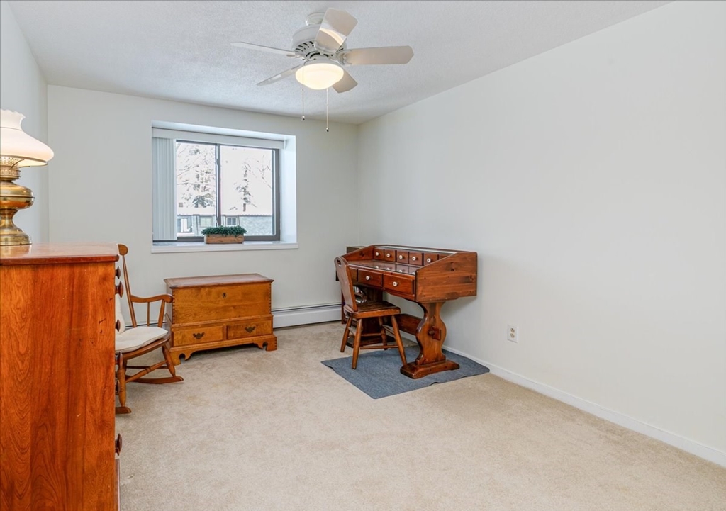 42 Main Street, Unit 22 North Reading, MA 01864 - Photo 24 of 37 a work room with furniture and windows