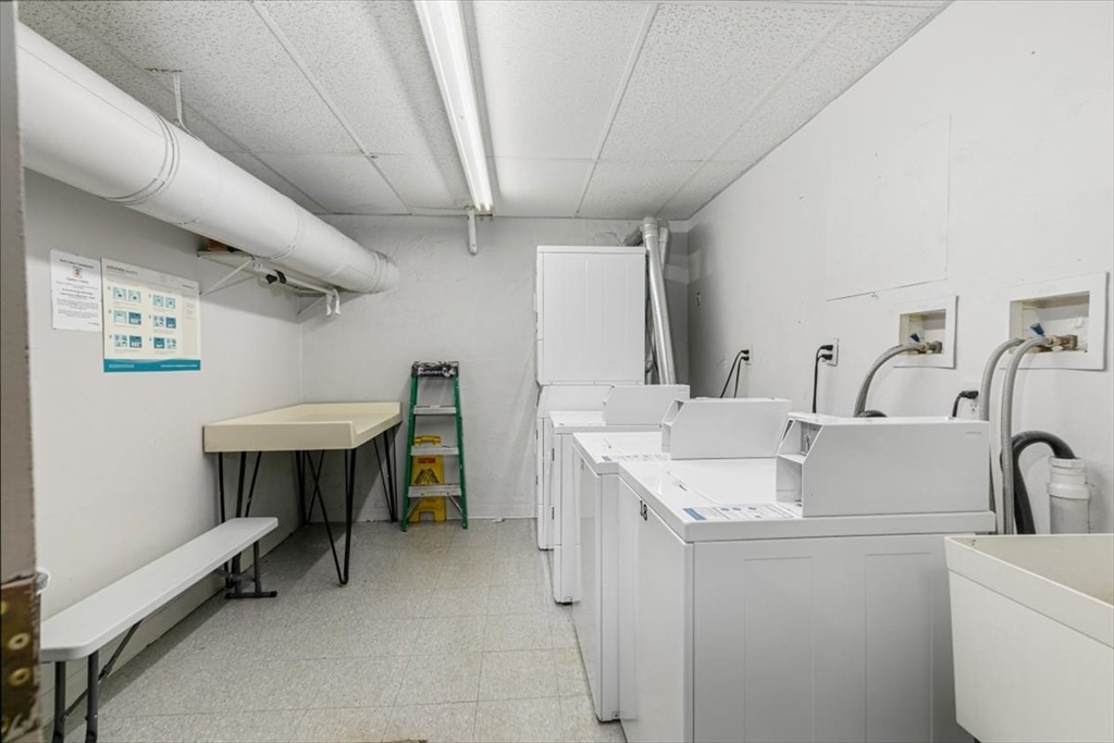 42 Main Street, Unit 22 North Reading, MA 01864 - Photo 28 of 37 a utility room with dryer and washer