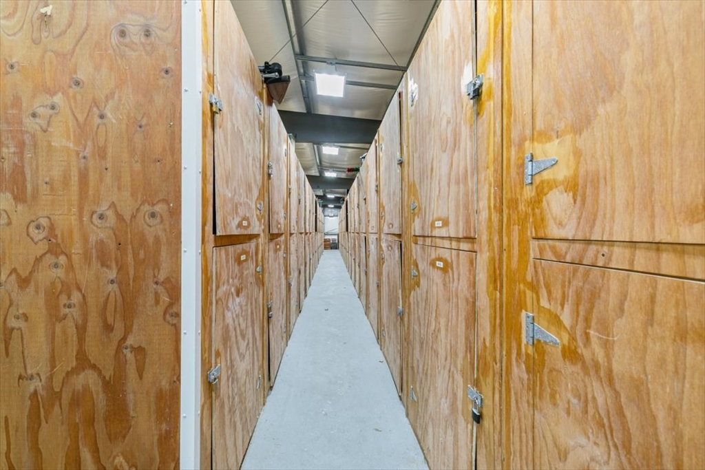 42 Main Street, Unit 22 North Reading, MA 01864 - Photo 30 of 37 a view of a door with wooden floor