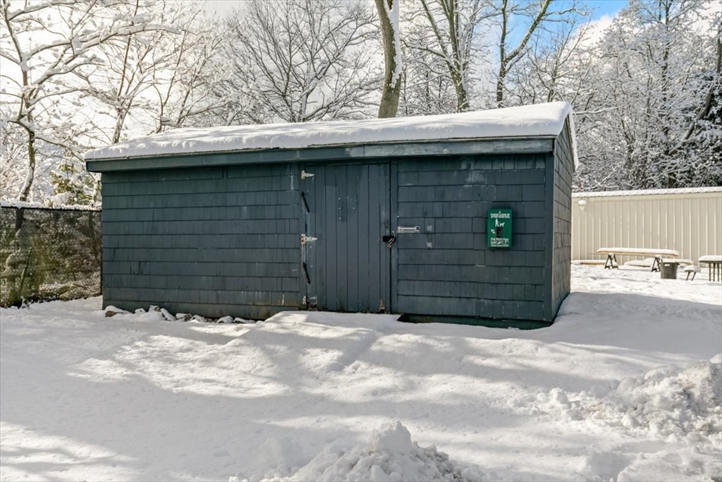 42 Main Street, Unit 22 North Reading, MA 01864 - Photo 36 of 37 a view of a house with a garage