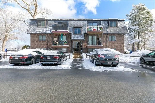 a view of a city street with a large building