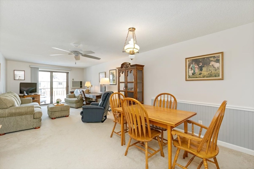 42 Main Street, Unit 22 North Reading, MA 01864 - Photo 5 of 37 a view of a livingroom with furniture and a couch