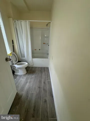 a view of a room with wooden floor and small space