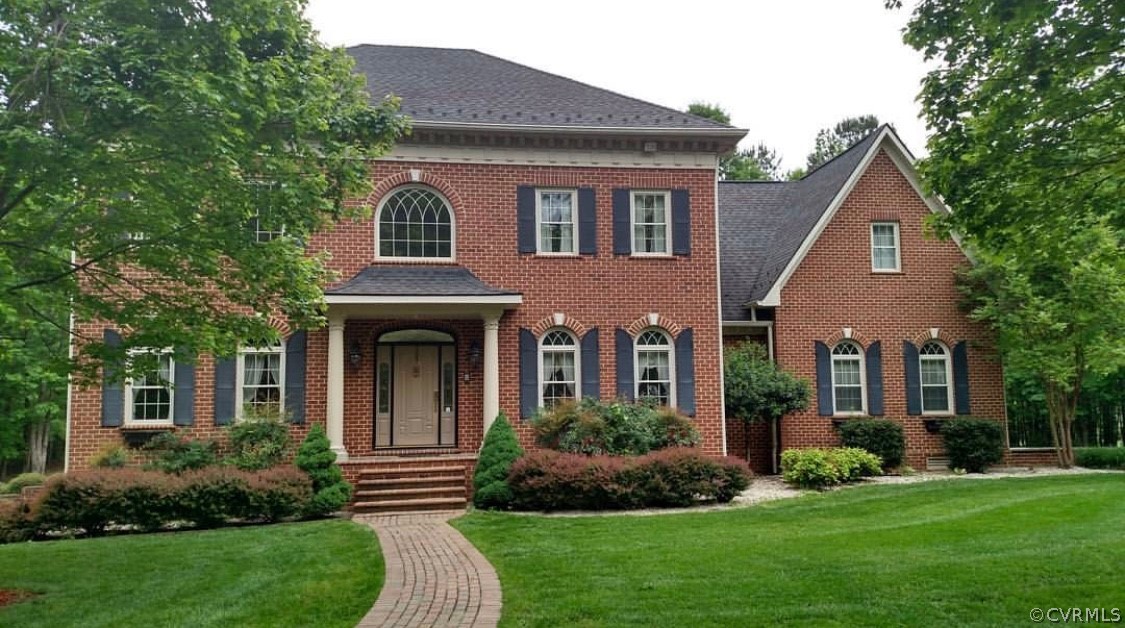 872 Wilson Road Wilsons, VA 23894 - Photo 1 of 34 a front view of a house with a yard