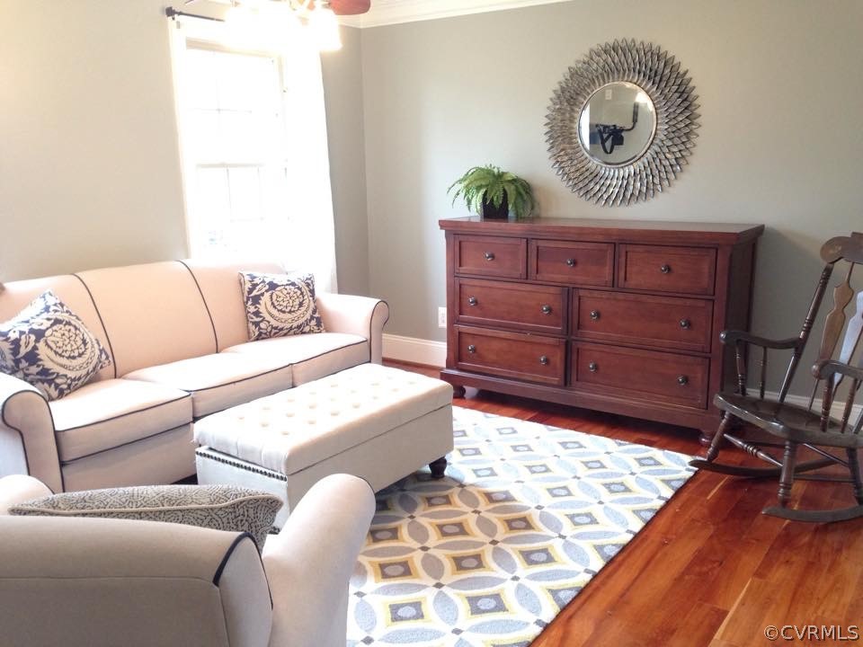 872 Wilson Road Wilsons, VA 23894 - Photo 15 of 34 a living room with a couch and a dresser