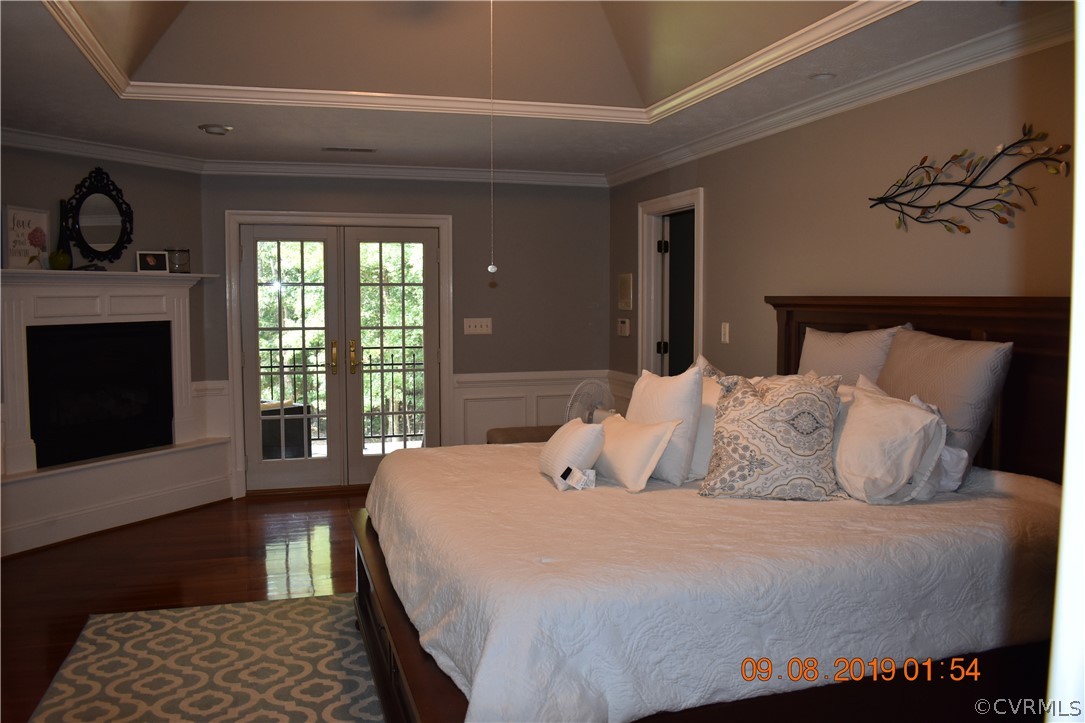 872 Wilson Road Wilsons, VA 23894 - Photo 16 of 34 a bedroom with a bed and a fireplace