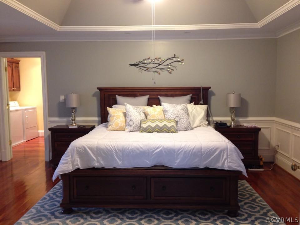 872 Wilson Road Wilsons, VA 23894 - Photo 17 of 34 a bedroom with a bed and wooden floor