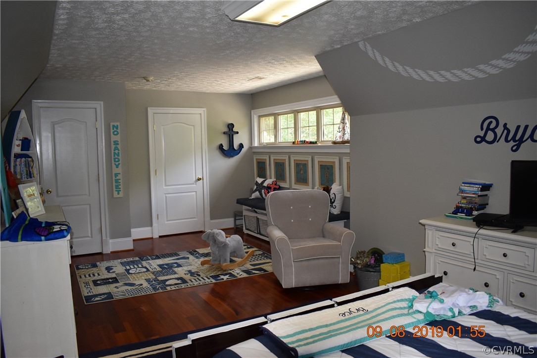 872 Wilson Road Wilsons, VA 23894 - Photo 23 of 34 a living room with furniture and a window
