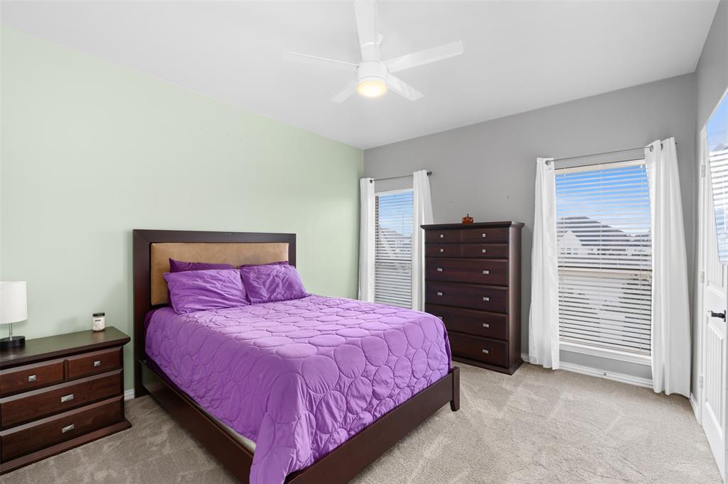 5412 Conch Train Road McKinney, TX 75070 - Photo 11 of 21 a bedroom with a bed and a dresser