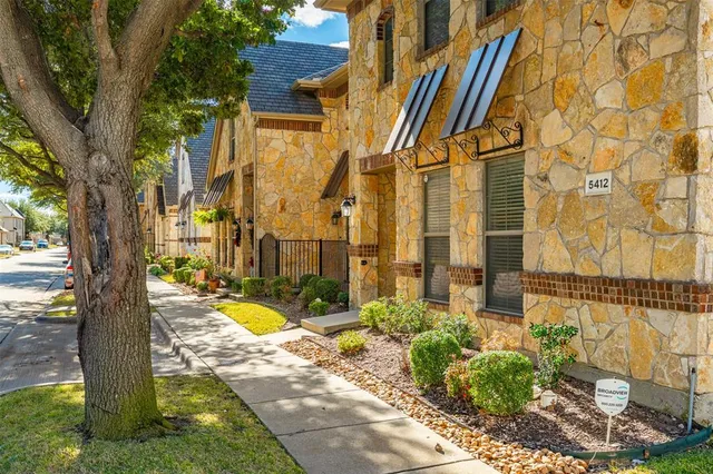 a view of a swimming pool with a house in the background