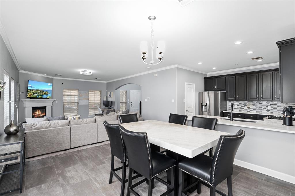 5412 Conch Train Road McKinney, TX 75070 - Photo 5 of 21 a view of a dining room with furniture