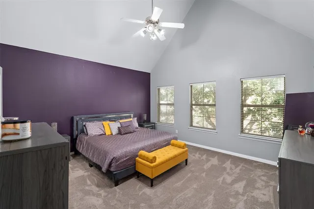 a bedroom with a bed and a couch