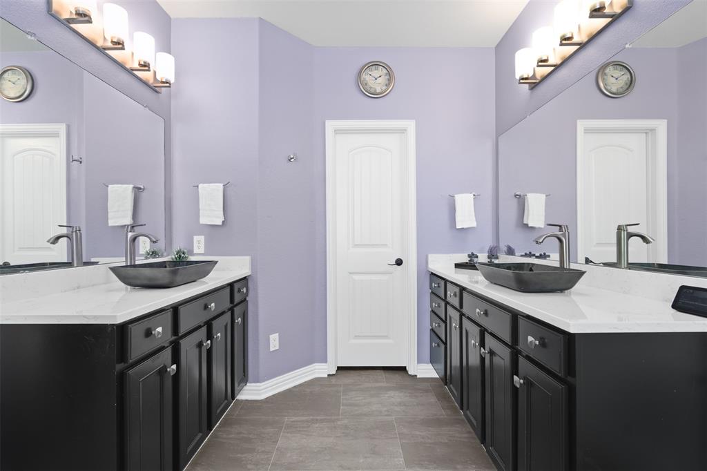 5412 Conch Train Road McKinney, TX 75070 - Photo 8 of 21 a kitchen with a sink stove and cabinets