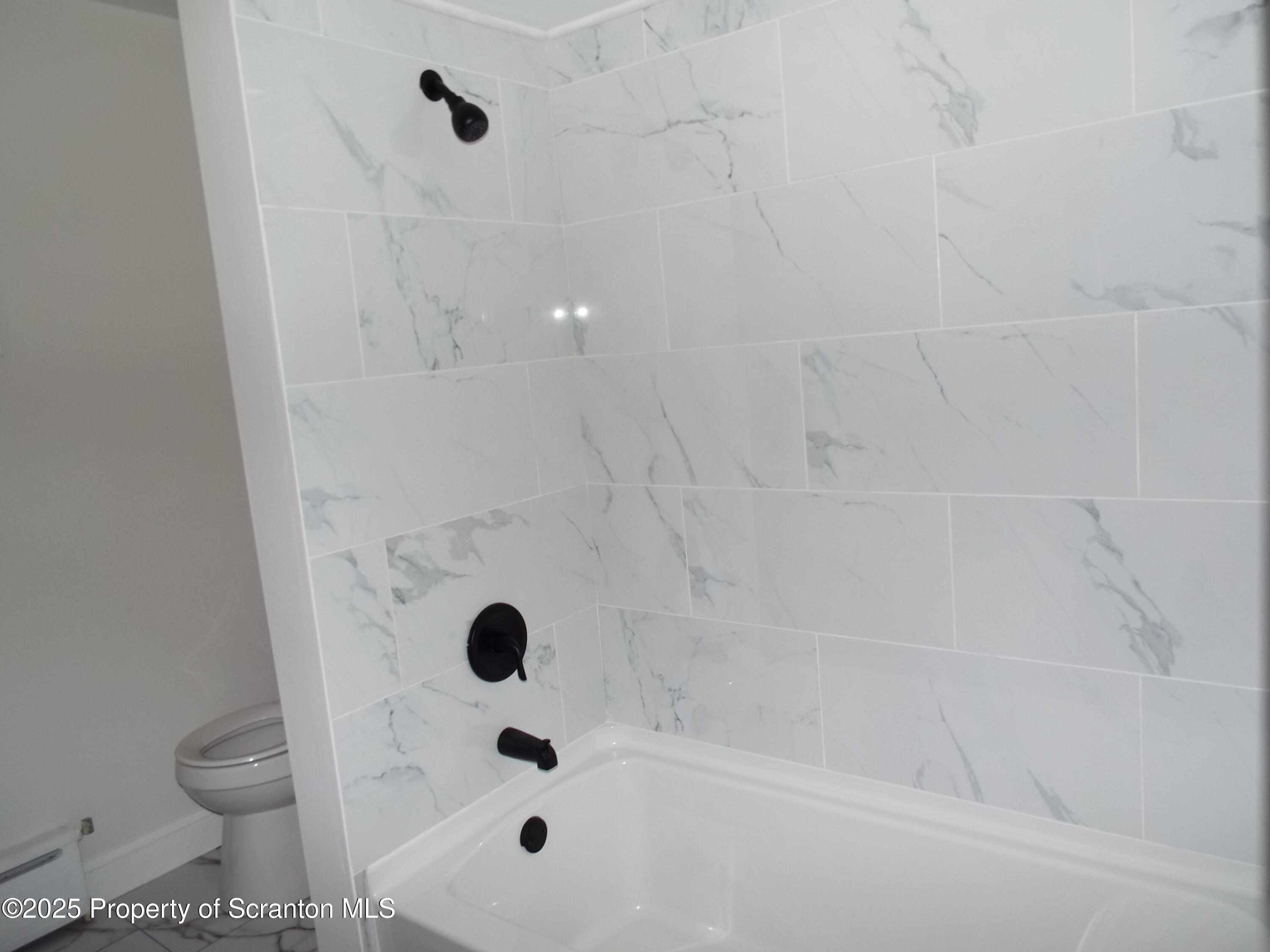 164 Welles Street Forty Fort, PA 18704 - Photo 24 of 25 a bathroom with a bathtub