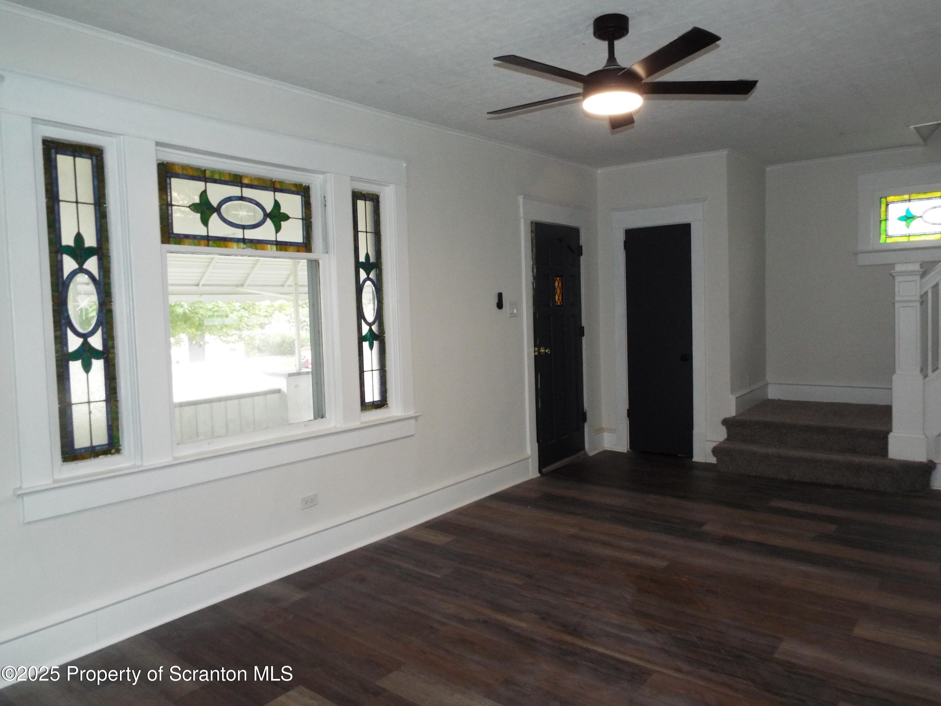 164 Welles Street Forty Fort, PA 18704 - Photo 10 of 25 a view of an empty room with wooden floor and a window