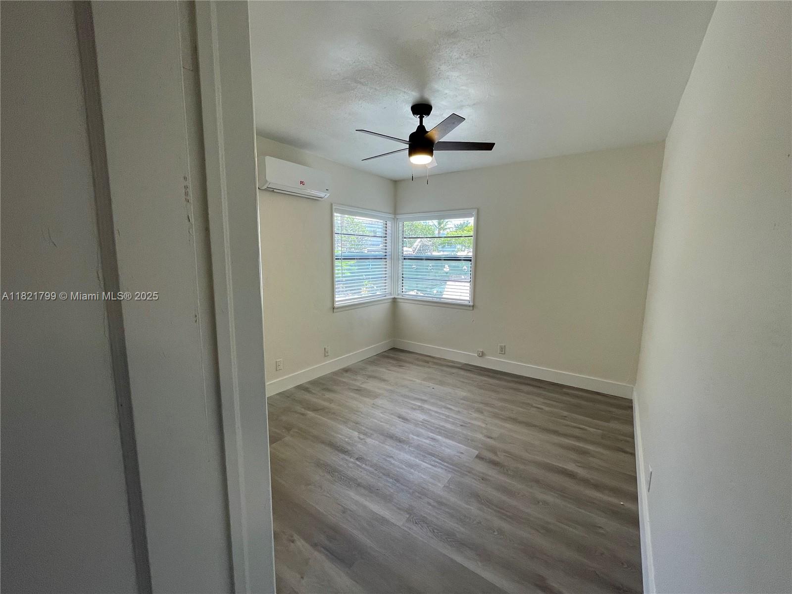 126 Northeast 19th Avenue, Unit 1 Pompano Beach, FL 33060 - Photo 7 of 7 a view of an empty room with a window