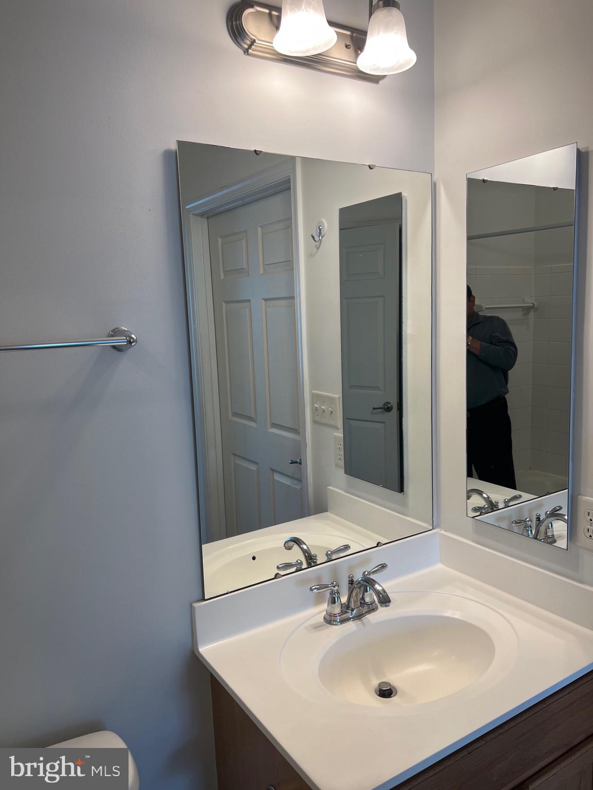 5301 Wyndholme Circle, Unit 304 Baltimore, MD 21229 - Photo 2 of 12 a bathroom with a sink and a mirror