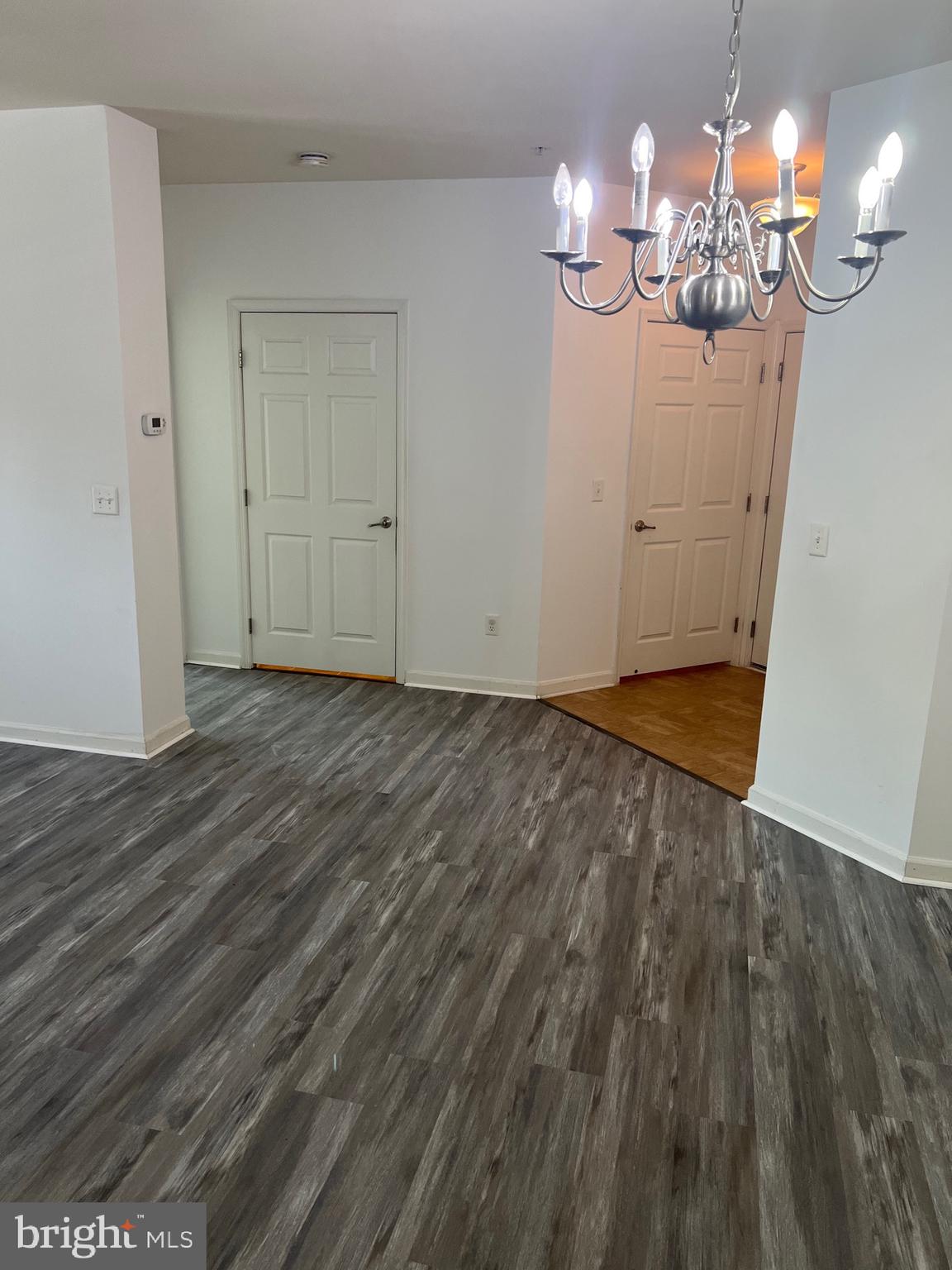 5301 Wyndholme Circle, Unit 304 Baltimore, MD 21229 - Photo 8 of 12 a view of a livingroom with wooden floor
