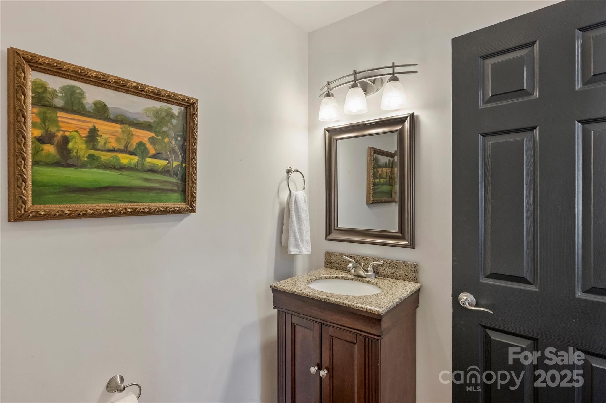 830 Jefferson Drive Charlotte, NC 28270 - Photo 16 of 38 a bathroom with a sink mirror and vanity