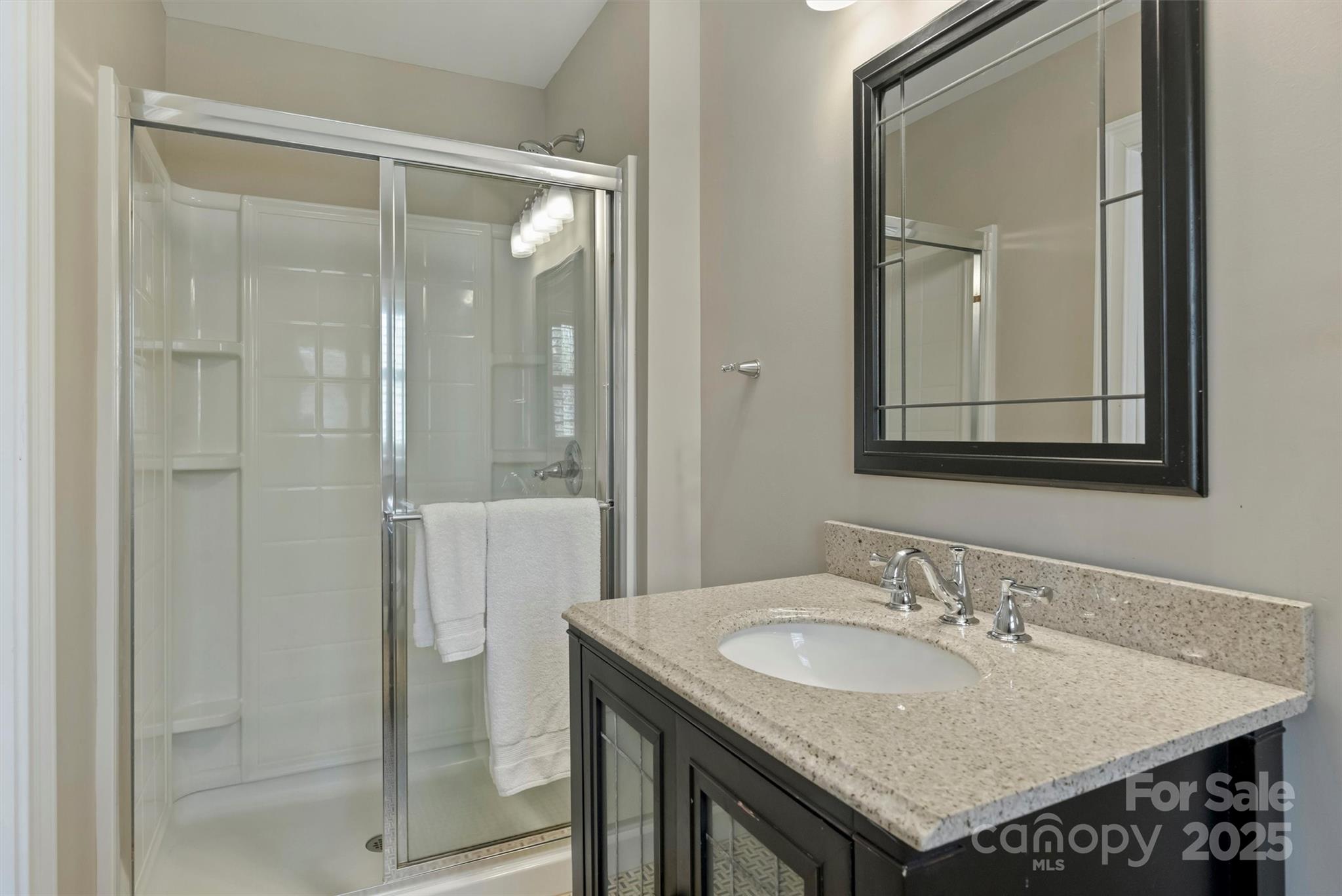 830 Jefferson Drive Charlotte, NC 28270 - Photo 22 of 38 a bathroom with a sink and a mirror