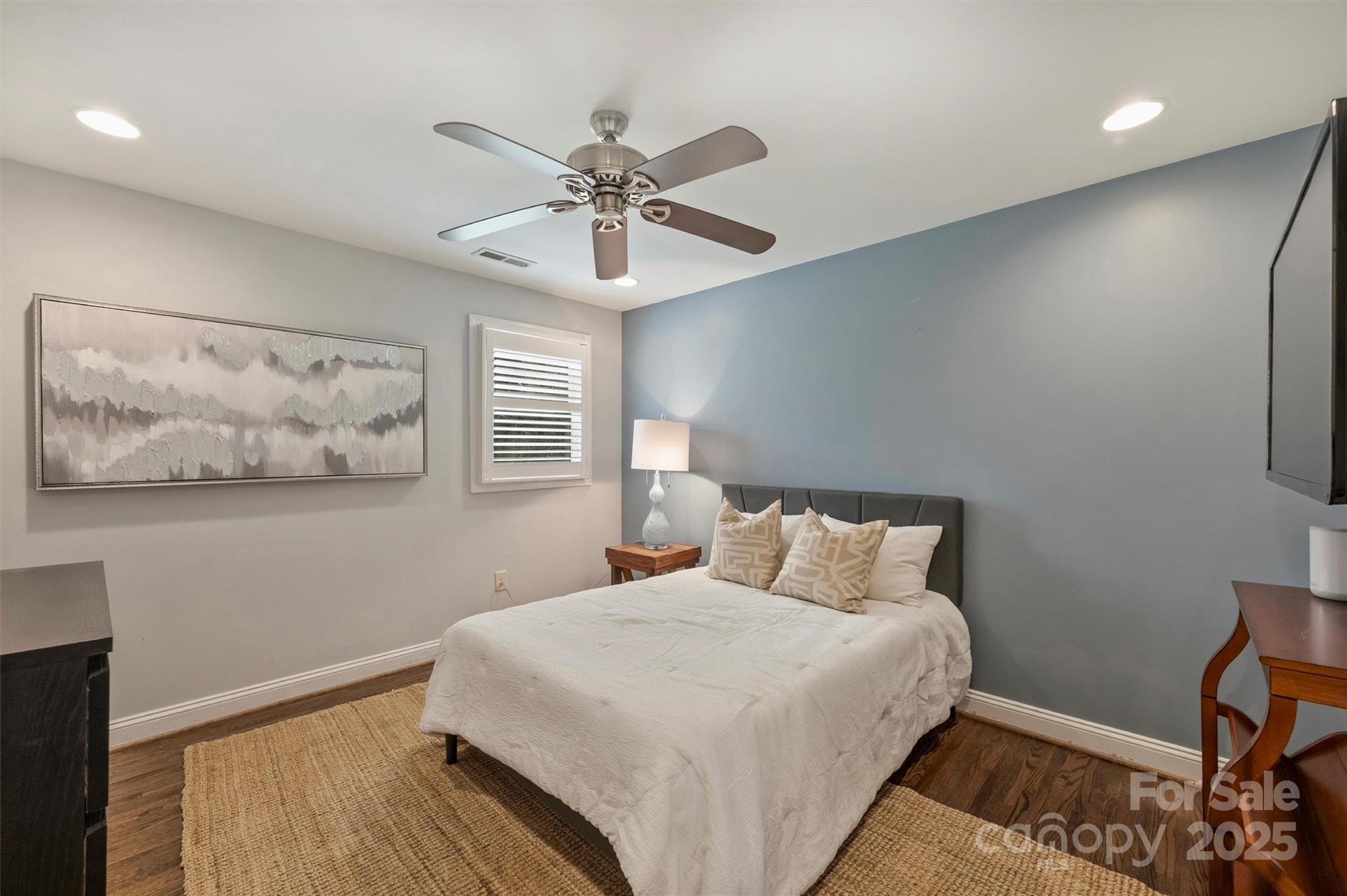 830 Jefferson Drive Charlotte, NC 28270 - Photo 23 of 38 a bedroom with a large bed and a chandelier