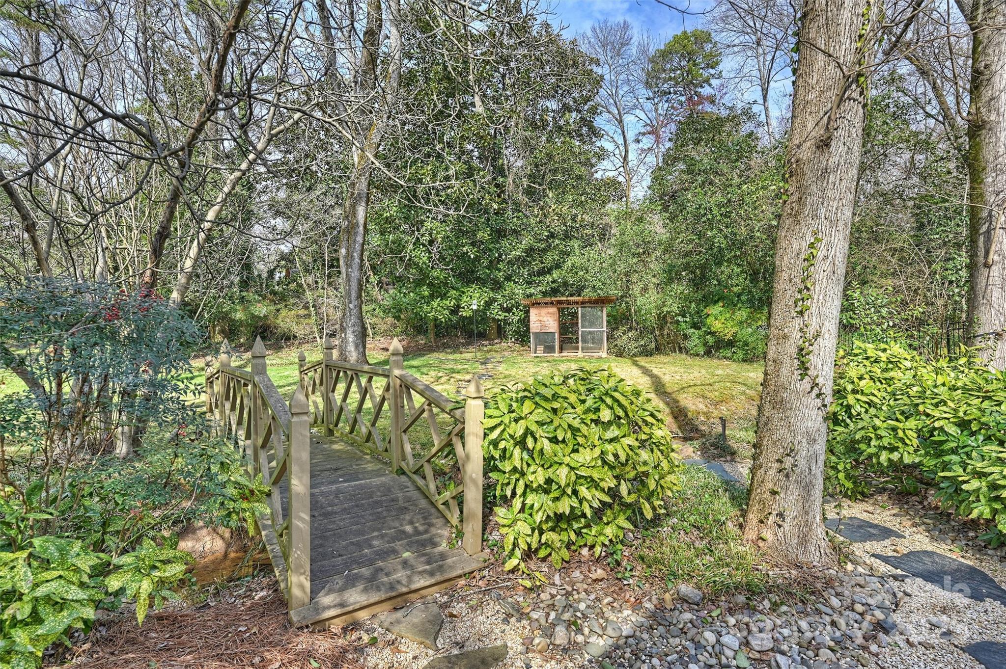 830 Jefferson Drive Charlotte, NC 28270 - Photo 38 of 38 a view of a yard with plants and large trees